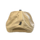 Beige cap with a black logo on the back against a white background