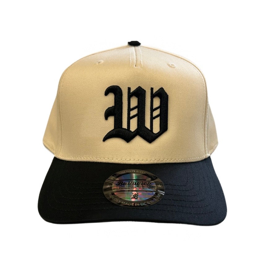 Beige and black cap with a large 'W' logo on a white background